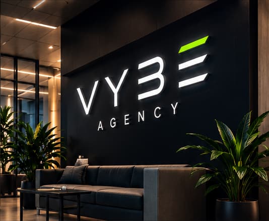 VYBE Agency office reception with illuminated logo